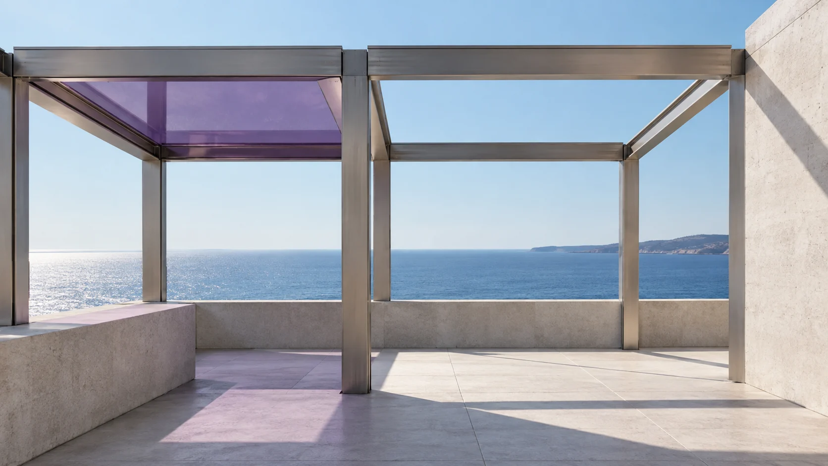 A steel frame of open bays on a terrace above the sea: one bay is roofed with amethyst glass and throws violet light on the stone, the others are still open to the sky.