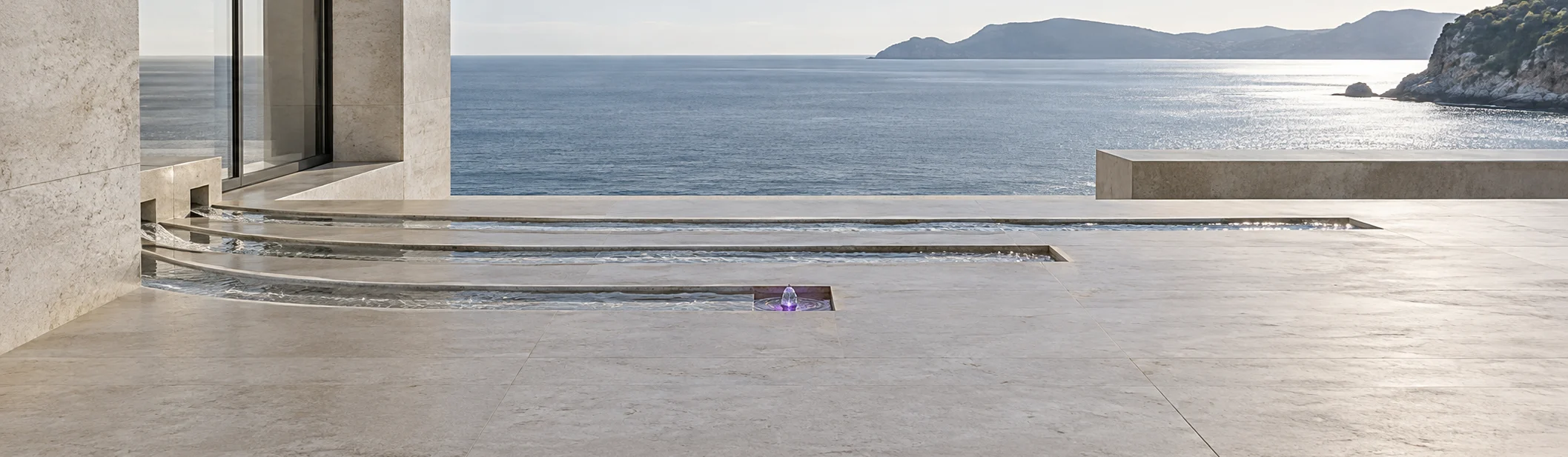 The stone terrace from higher up: three parallel rills start at one edge and end at three different points, the shortest marked by a single violet light.