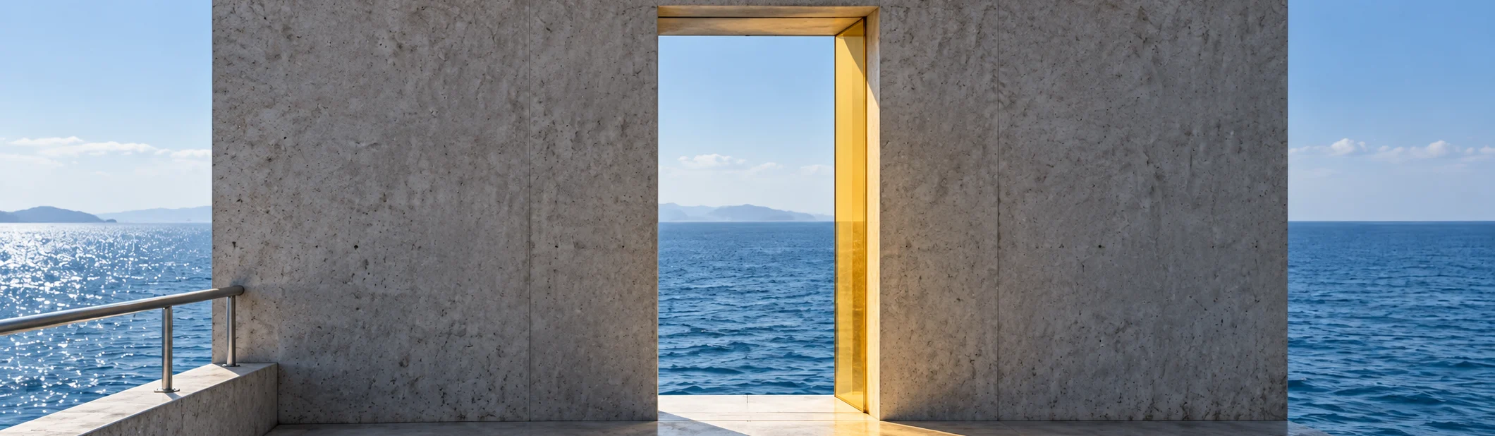 The end wall of the pier at eye level: one door-width opening in it with a citrine reveal, the sea beyond, and yellow light falling through on to the deck.